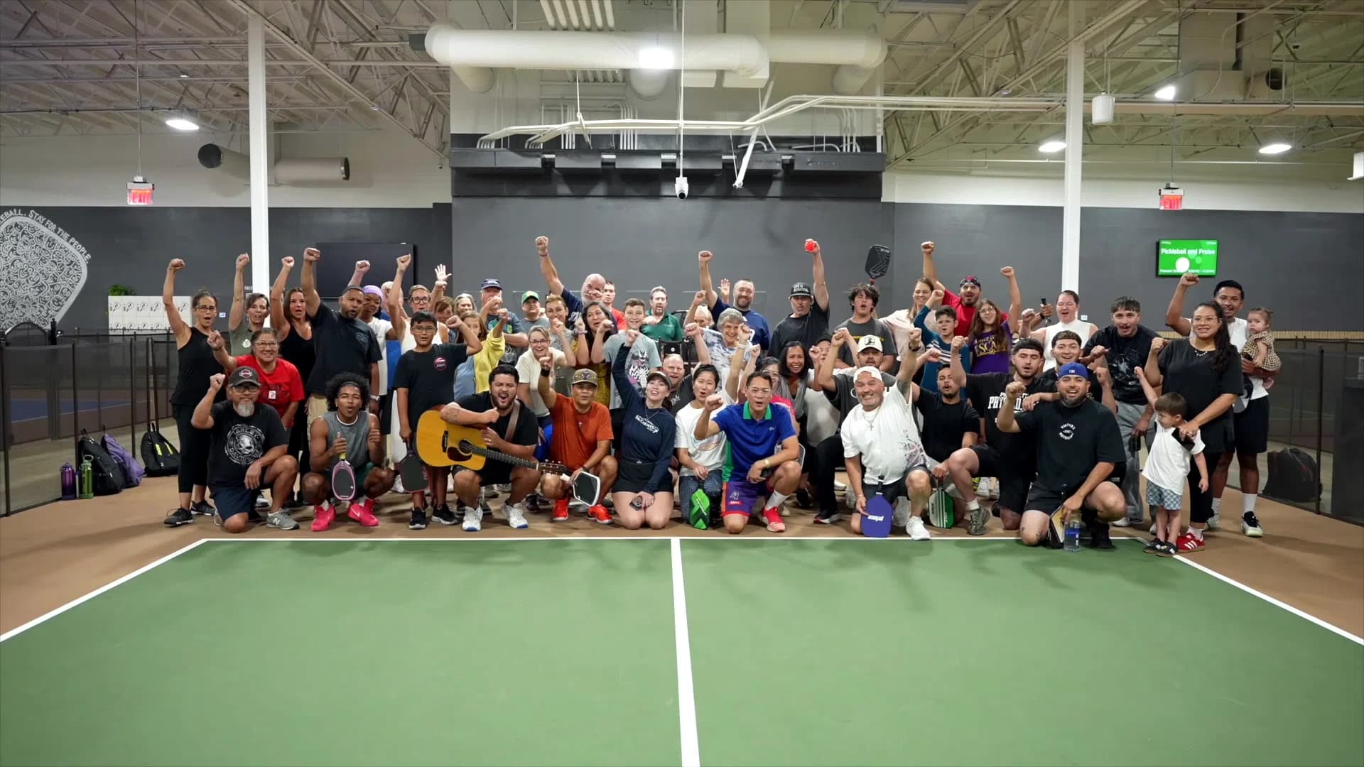 Large group celebrating a pickleball event at The Courts LV